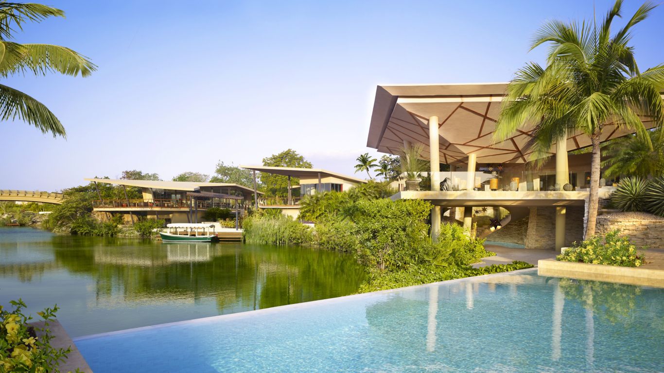 view from the pool to the lobby at rosewood mayakoba