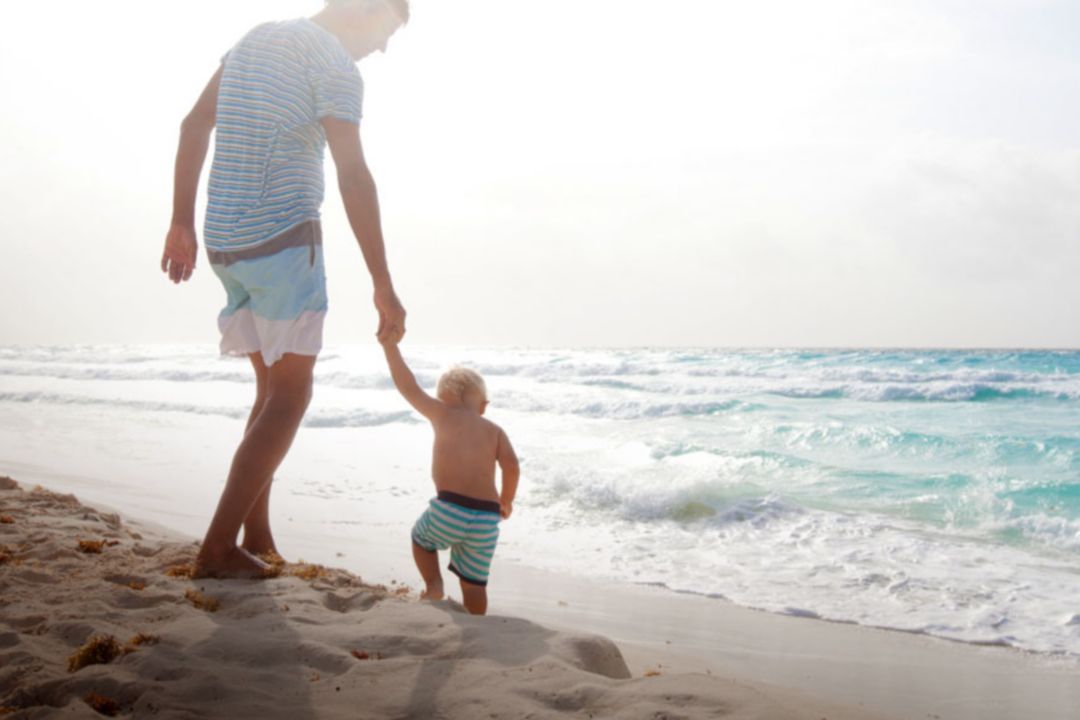 Father and son on beach