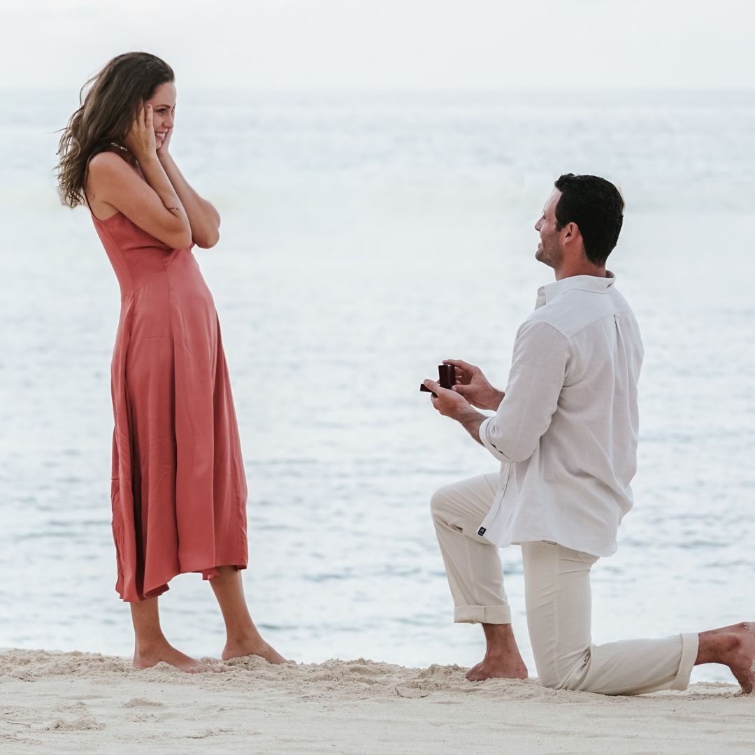 women in white dress kneeling with ceremonial drums and incense smoke for Rosewood Mayakoba's Marry Oneself Ceremony at Sense Spa