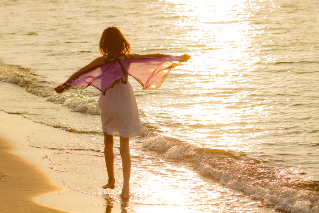 Child Playing on Beach
