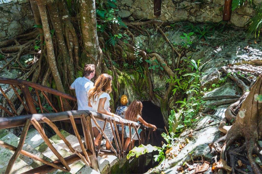 Family walking into cave