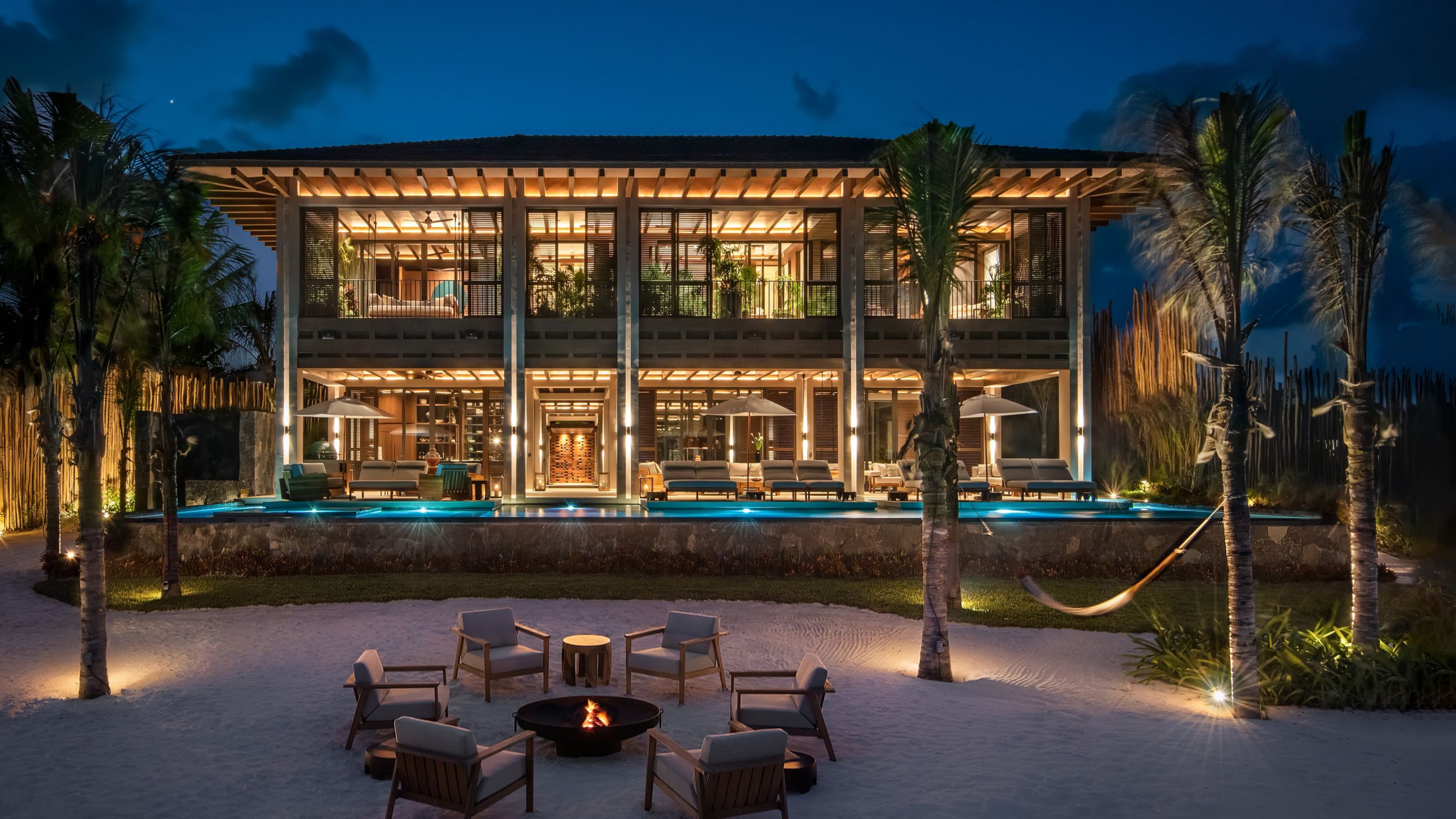 Beachfront Villa_Living and dinidng room with couches, chairs, dining set and hanging lamps