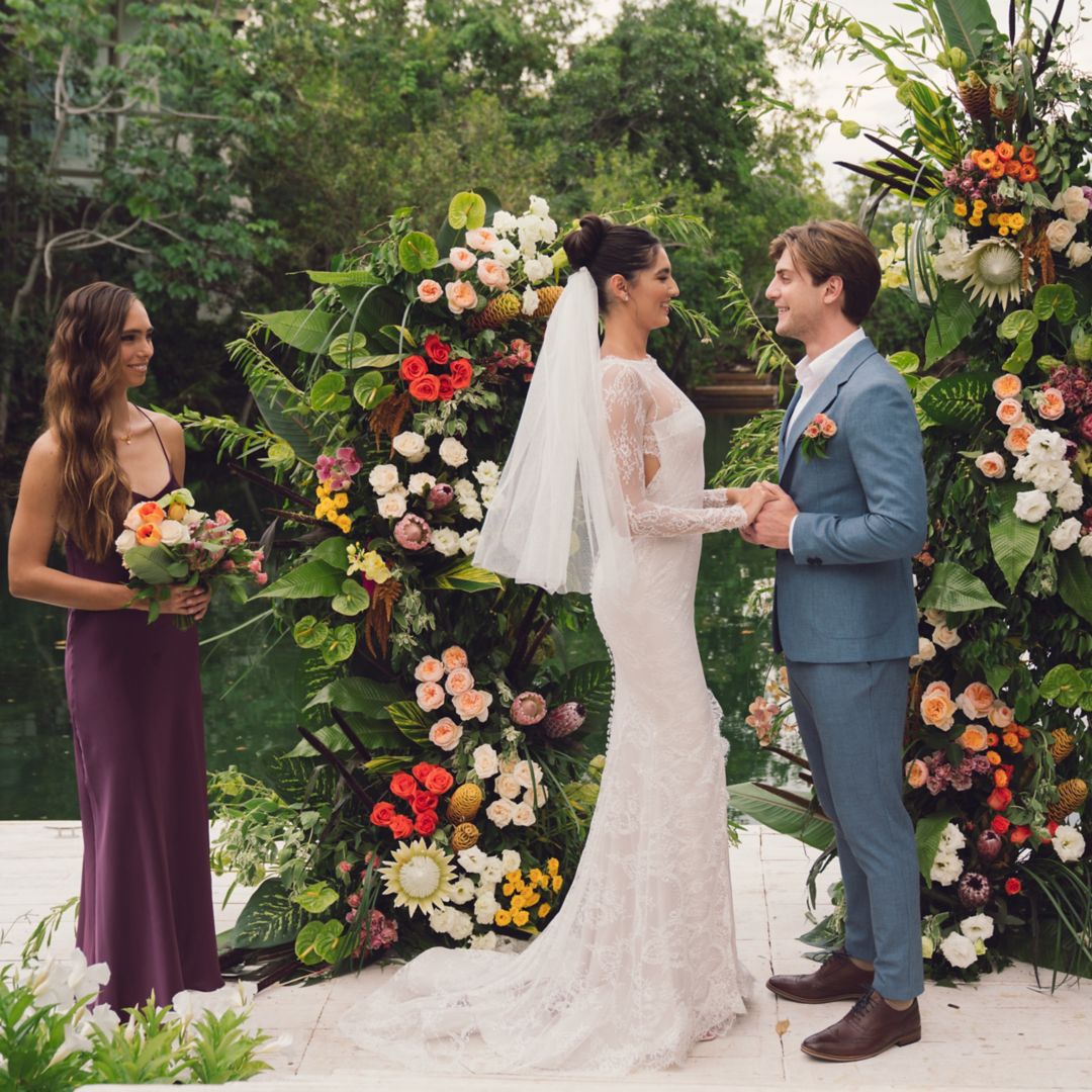 women in white dress kneeling with ceremonial drums and incense smoke for Rosewood Mayakoba's Marry Oneself Ceremony at Sense Spa