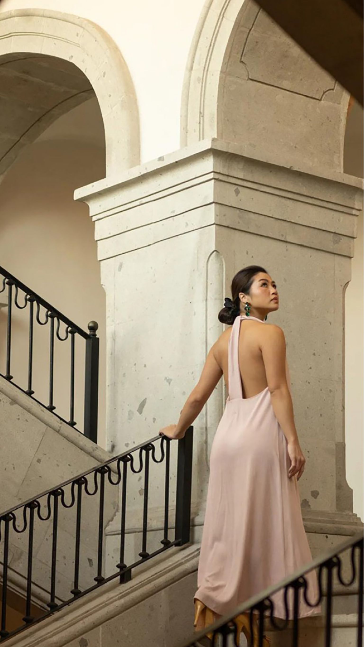 Woman ascending staircase