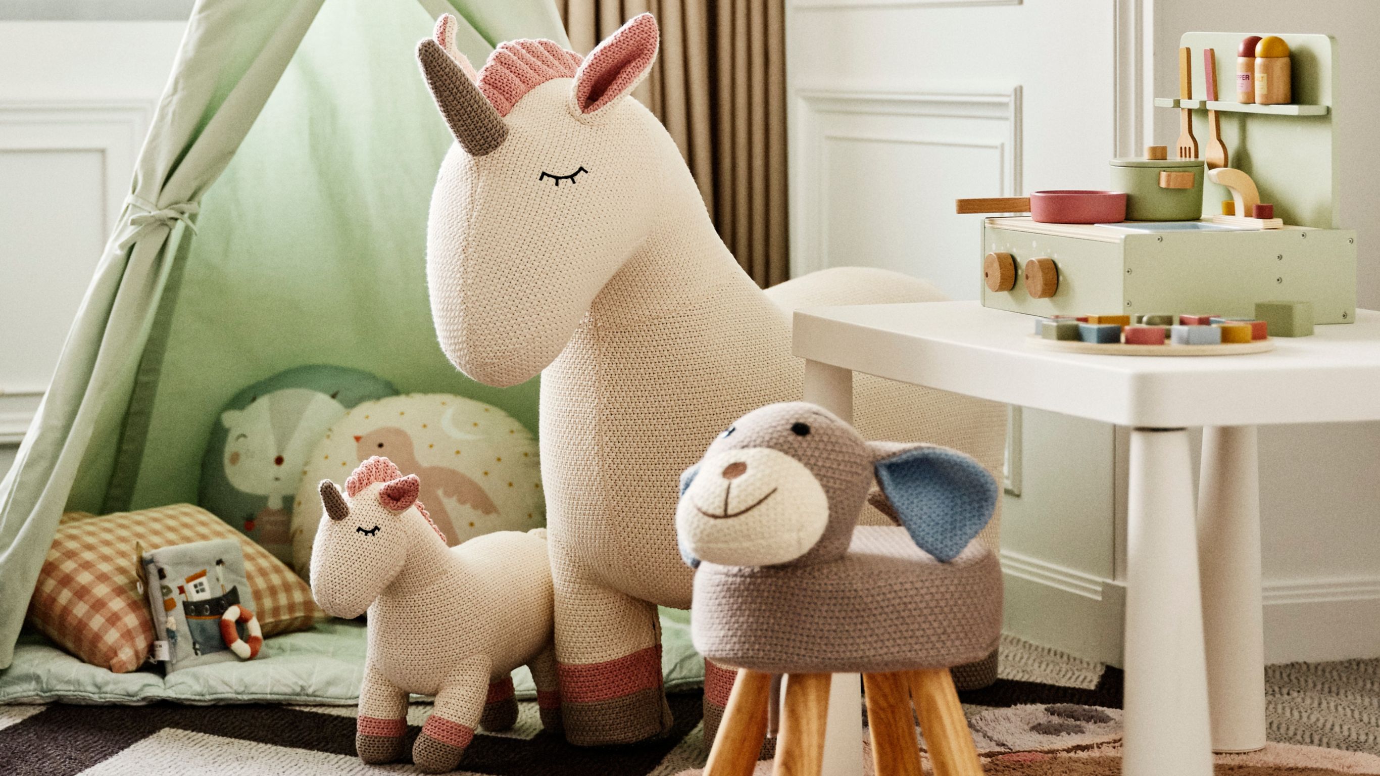 kids amenities at a hotel suite with toys and tipi tent