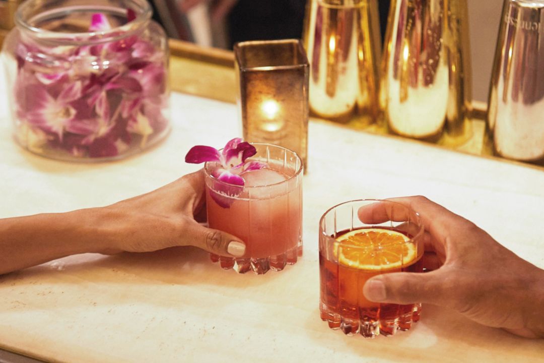Couple sitting at bar with beverages