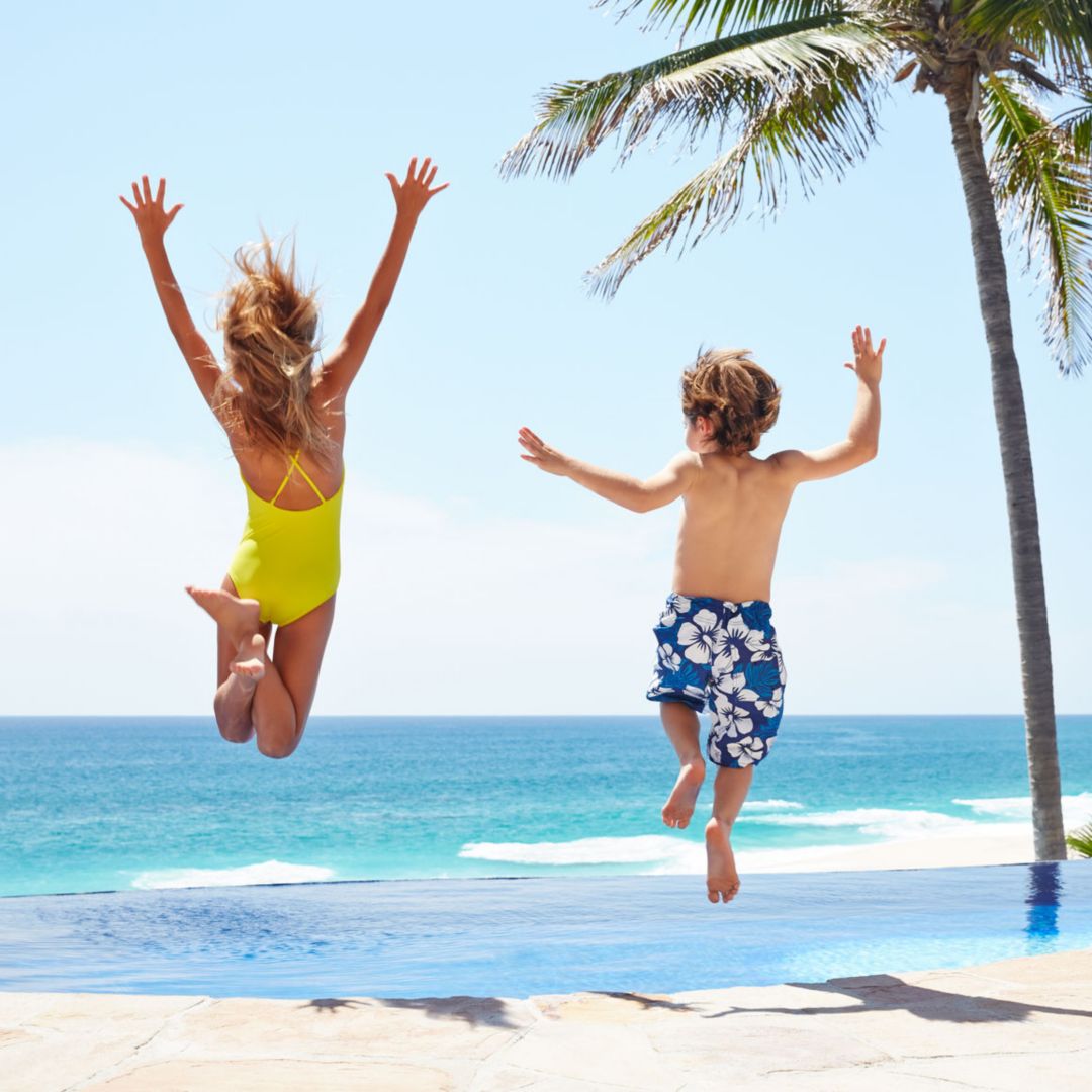 Children jumping into pool