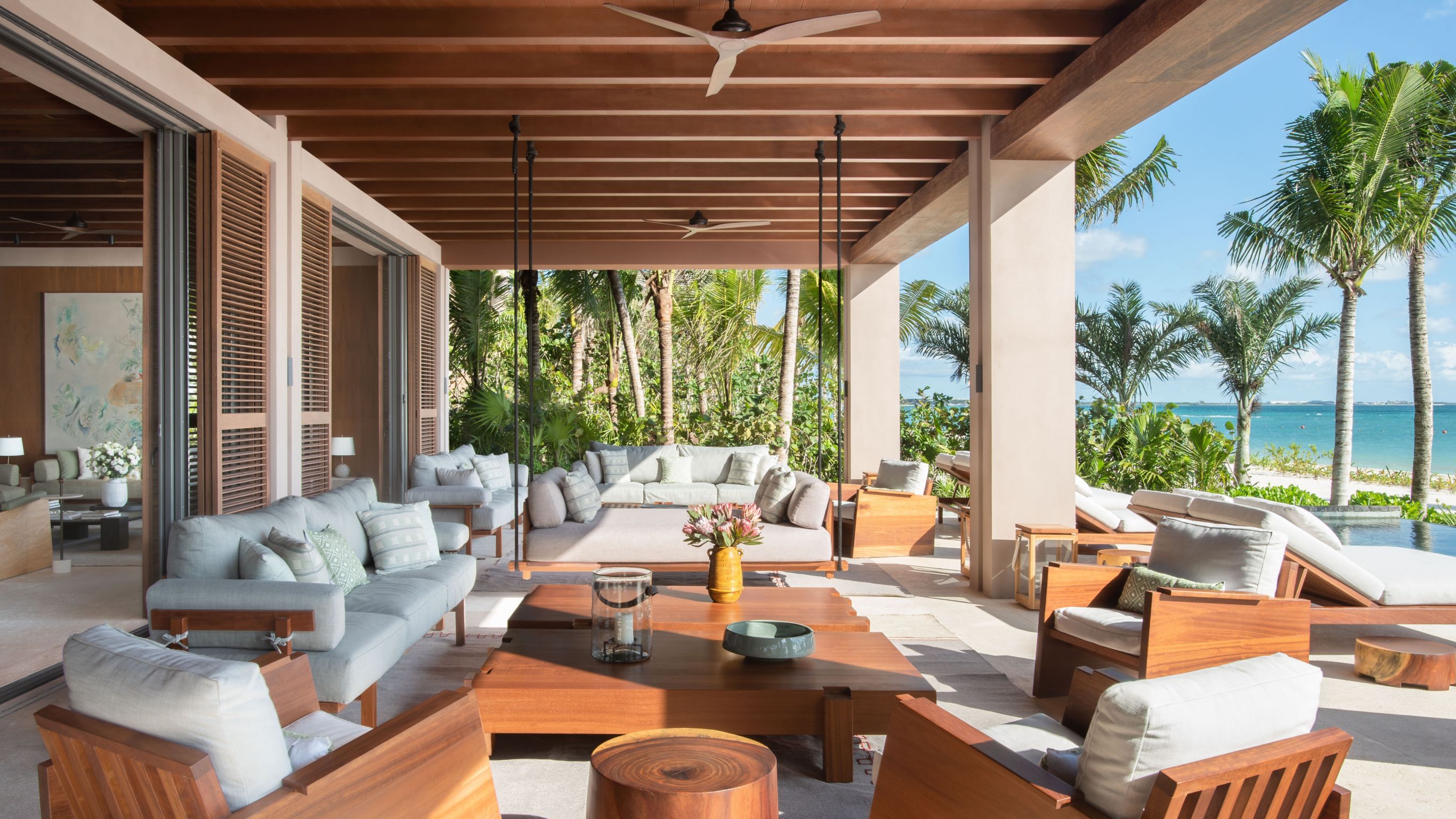 Beachfront Villa_Living and dinidng room with couches, chairs, dining set and hanging lamps