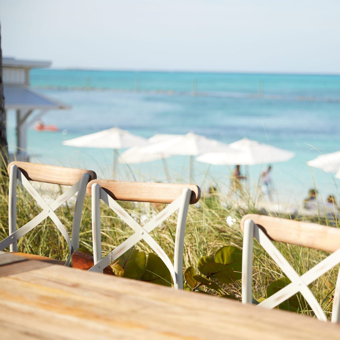 Tingum on the sand table looking out to the ocean