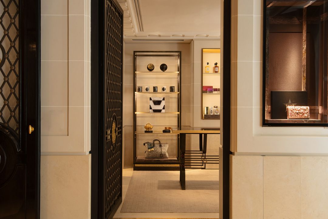 A boutique interior featuring elegant displays  of handbags and accessories.