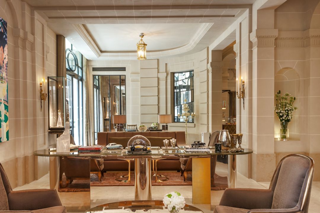 A hotel lobby with luxurious seating featuring plush chairs and decorative tables.