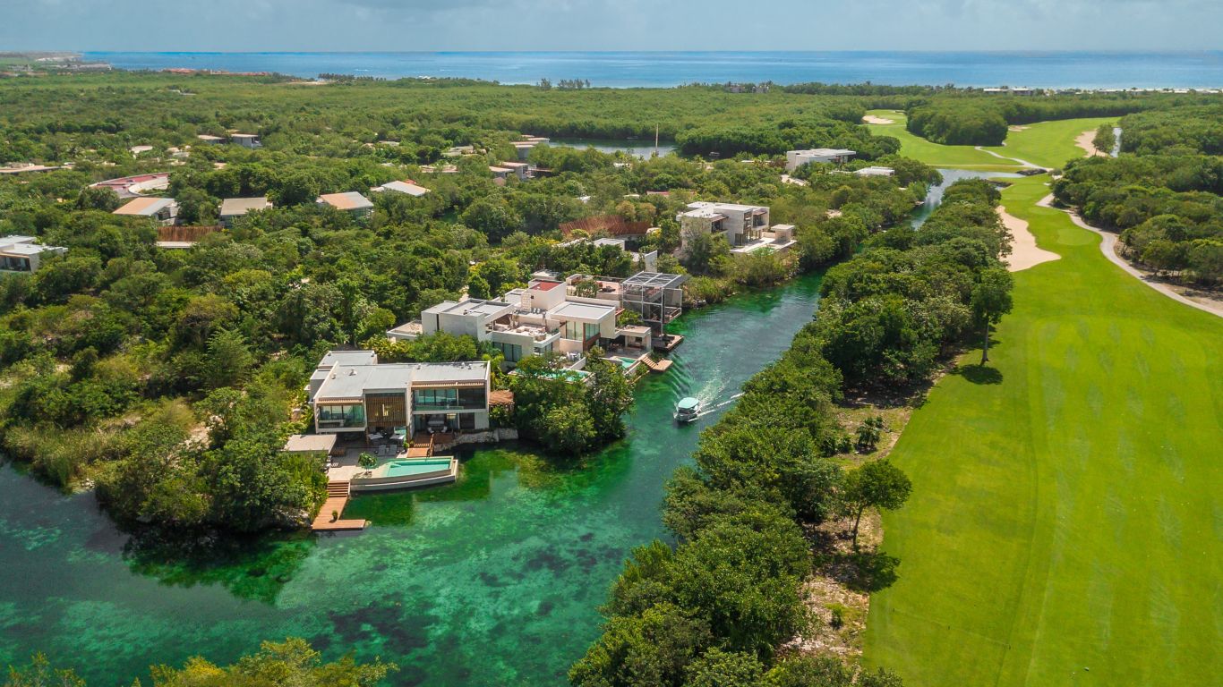 Aerial shot of canals and lagoons with boat passing by