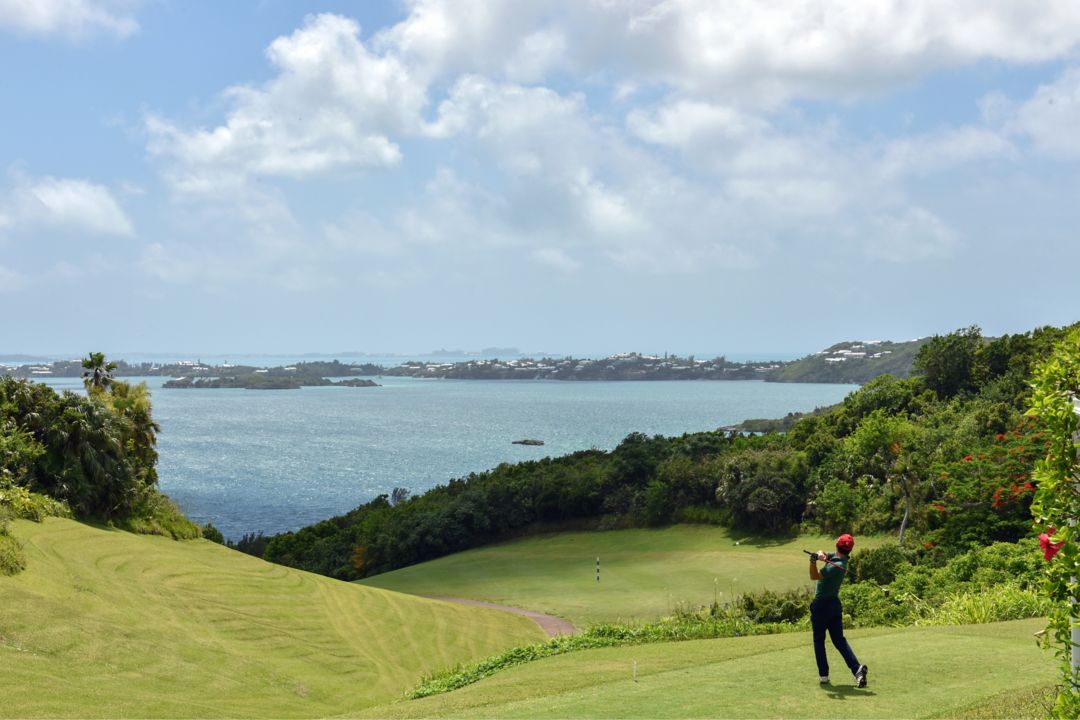 Golf Green looking on Turquoise water and blue skies