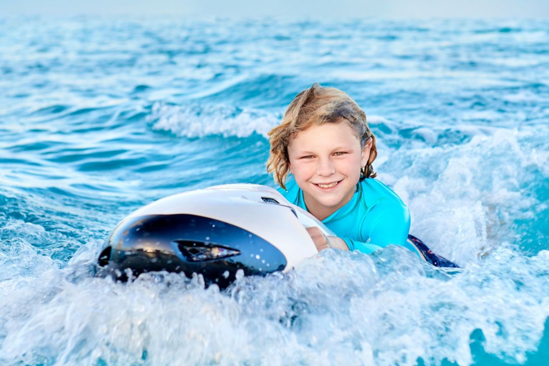 child doing water activities