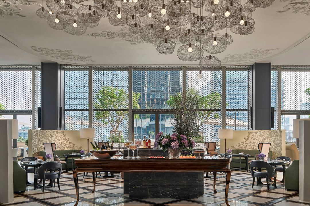 Lakorn Thai restaurant in Bangkok, with luxurious seating, ornate lighting, and a view of the city