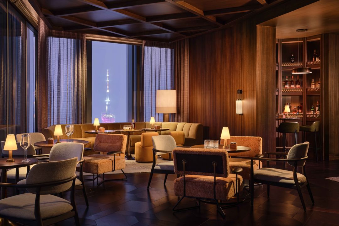 https://images.rosewoodhotels.com/is/image/rwhg/rwgzu-too-high-interior-with-canton-tower-view:WIDE-LARGE-3-2