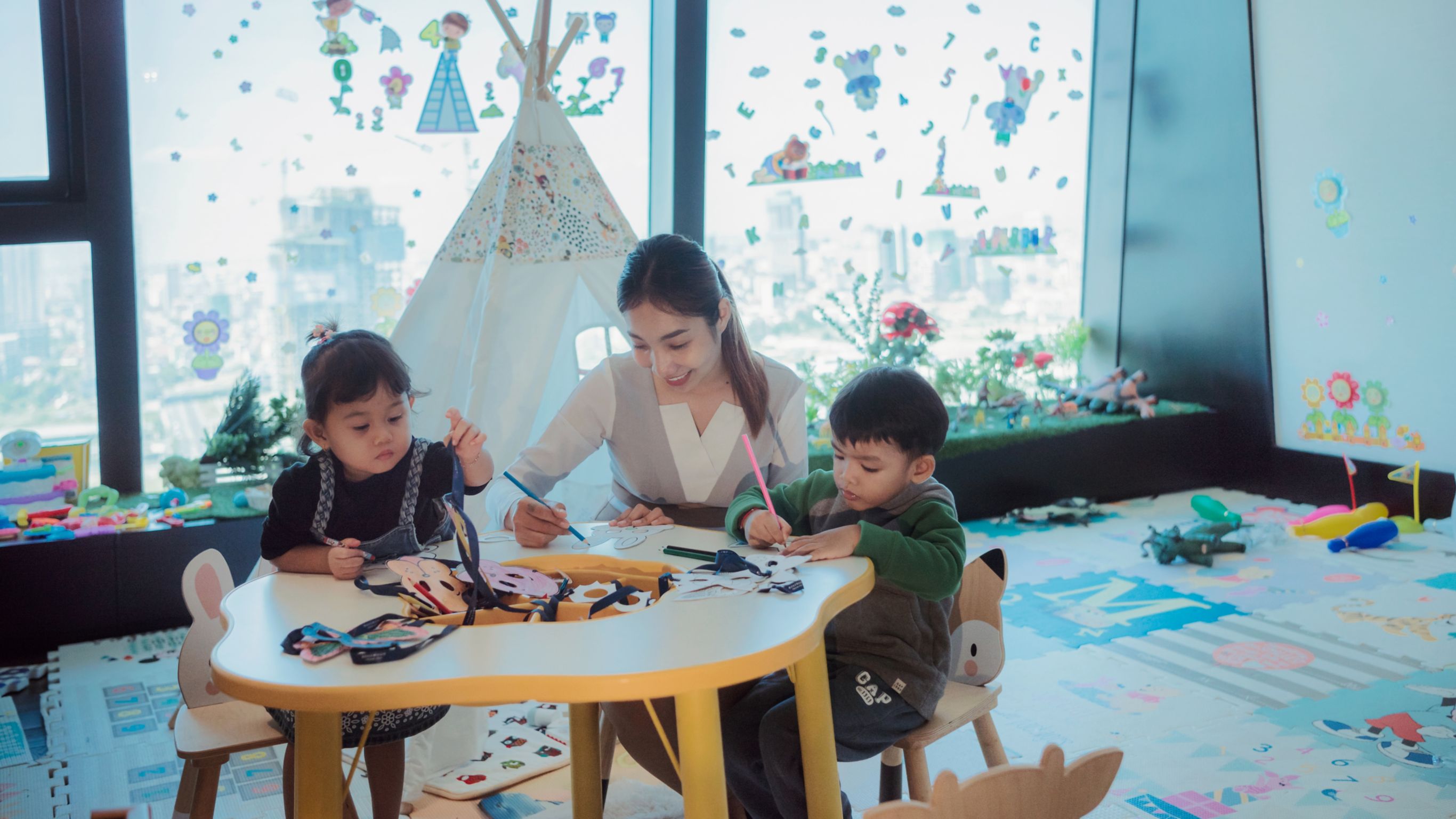 Children learning caretaker kids' club Rosewood Phnom Penh