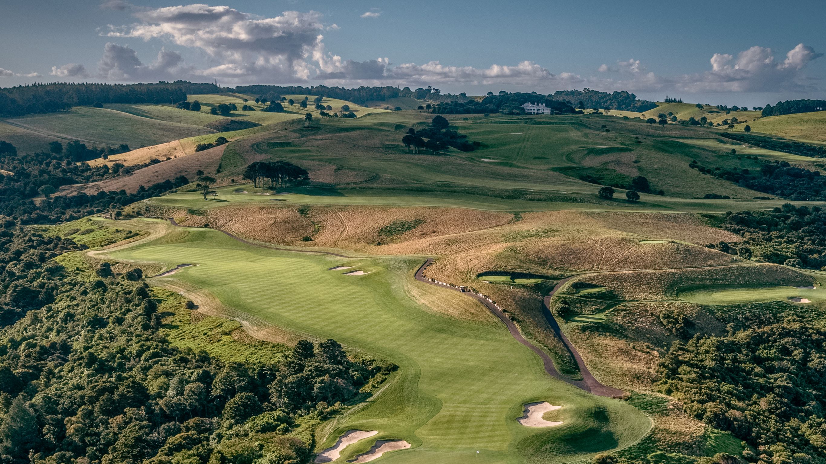 Aerial view looking up the fairway towards the Kauri Cliffs lodge