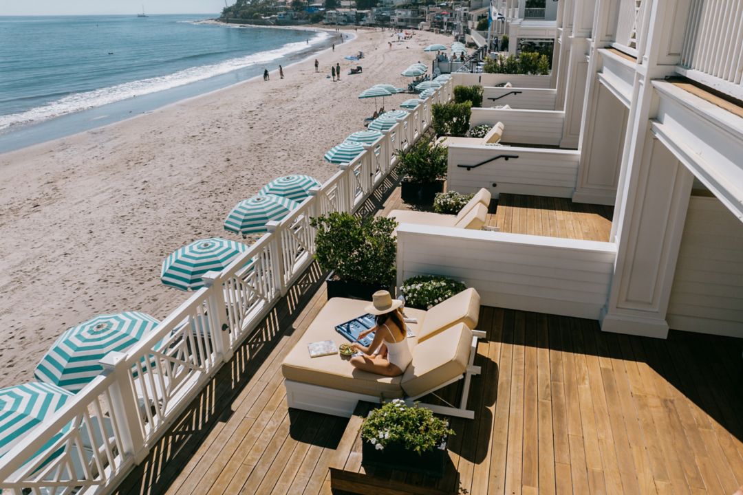 Woman In Beach House Terrace Suite at Miramar Beach