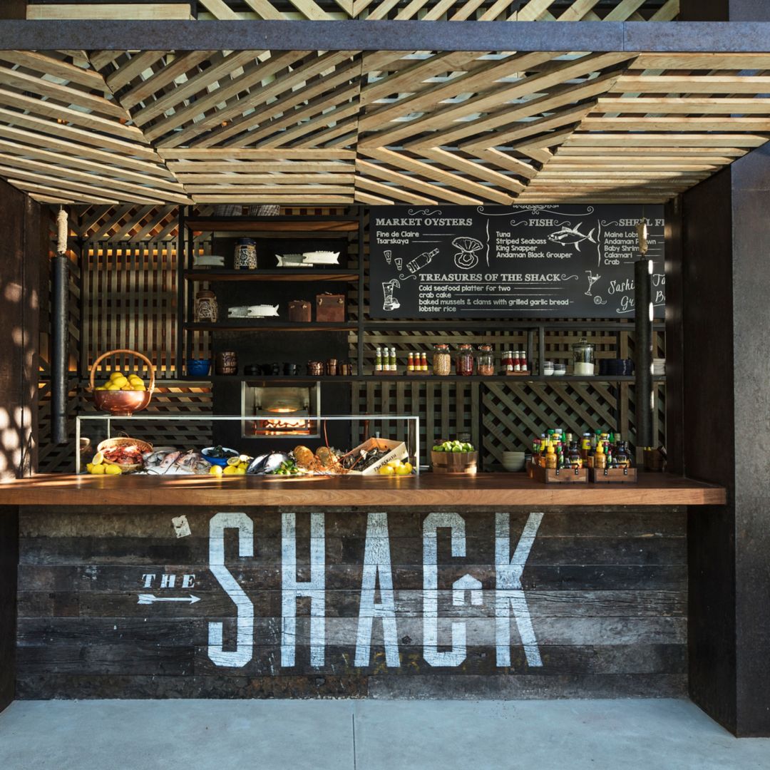 A rustic outdoor dining venue named "The Shack" at a luxury resort in Phuket.